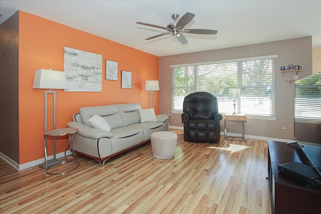 living room with ceiling fan and light wood-type flooring