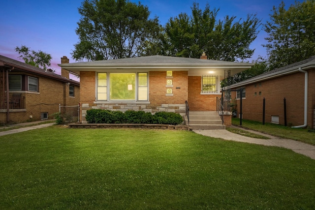 view of front of home with a yard