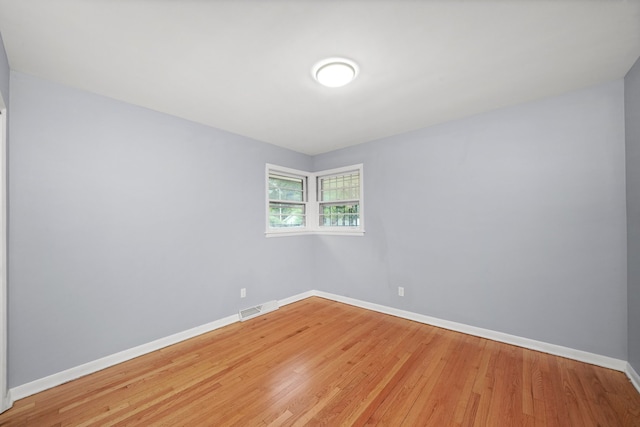 spare room featuring hardwood / wood-style flooring