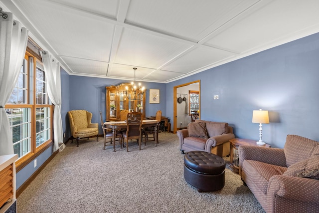 living room featuring ornamental molding, carpet floors, an inviting chandelier, and coffered ceiling