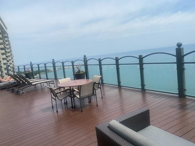 wooden terrace with a water view