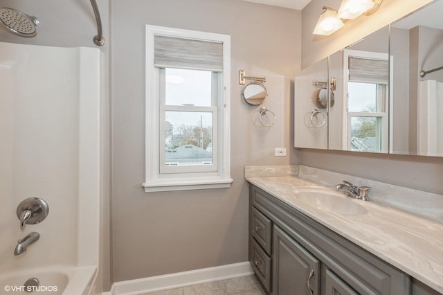 bathroom featuring bathtub / shower combination and vanity