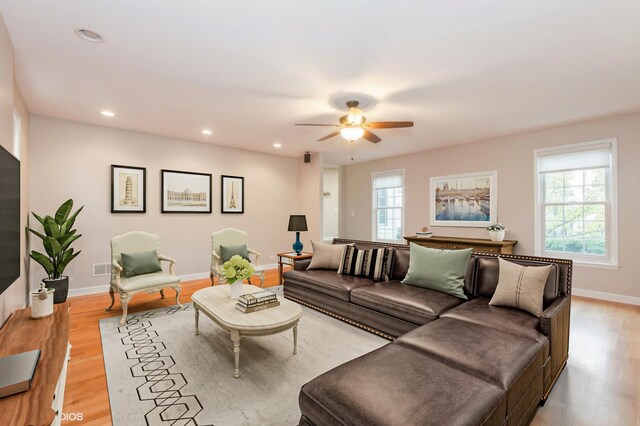 empty room featuring ceiling fan and light hardwood / wood-style flooring