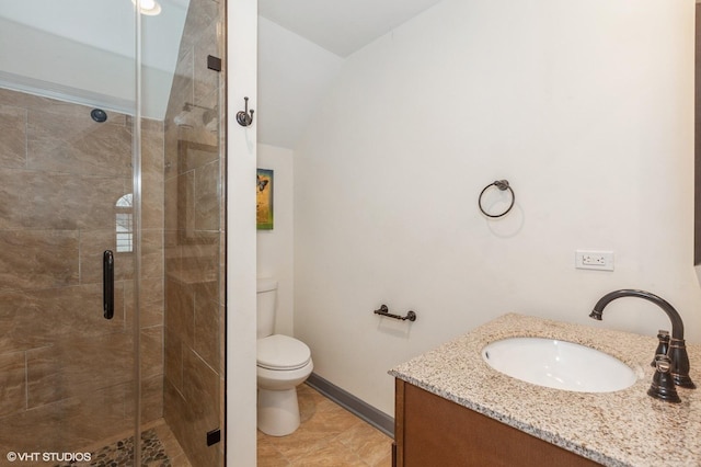 bathroom with toilet, an enclosed shower, and vanity