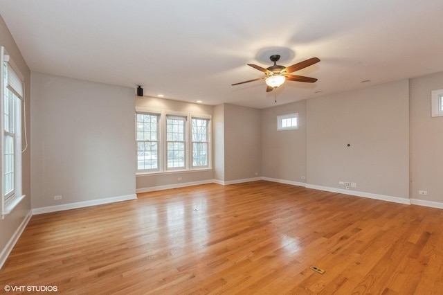 spare room featuring ceiling fan and light wood-type flooring