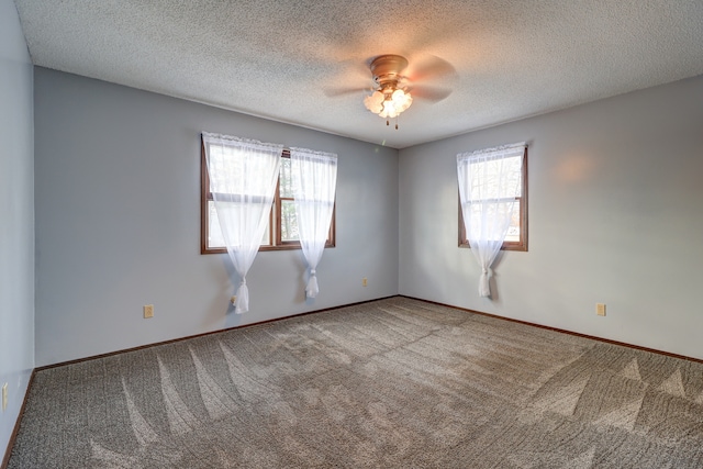 unfurnished room featuring carpet, a textured ceiling, and ceiling fan