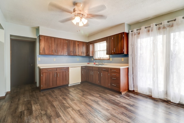 kitchen with ceiling fan, dishwasher, dark wood-type flooring, and a textured ceiling