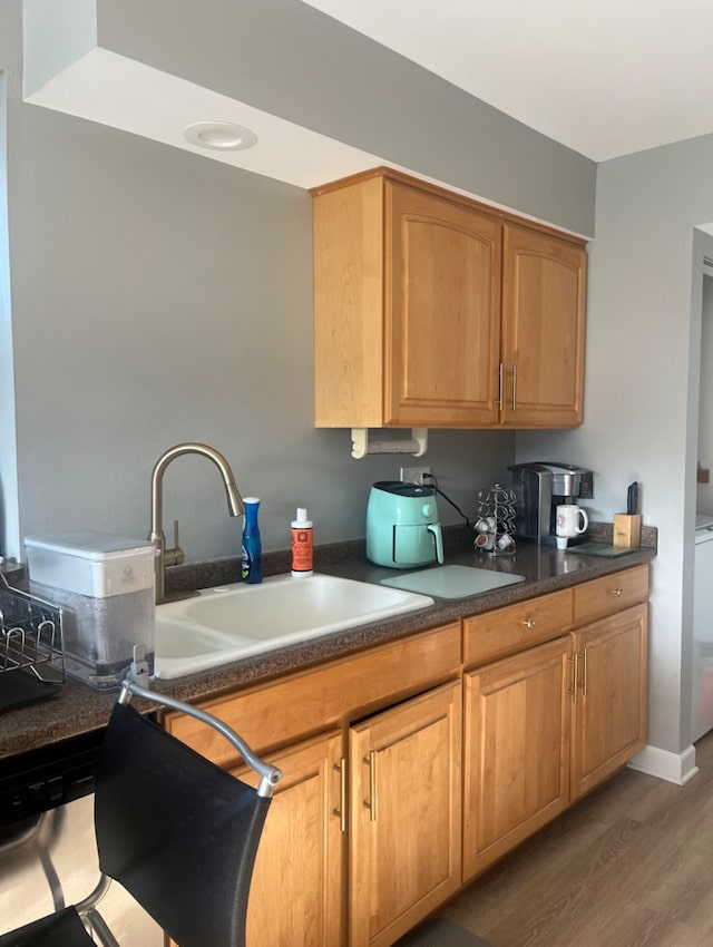 kitchen featuring dark hardwood / wood-style floors and sink