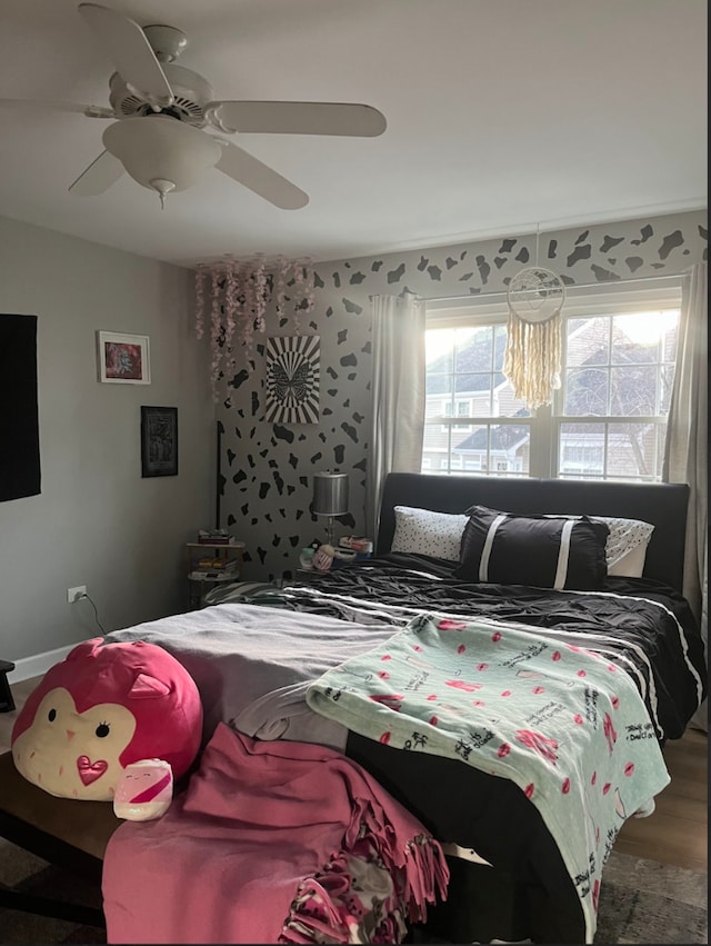 bedroom featuring ceiling fan and hardwood / wood-style floors