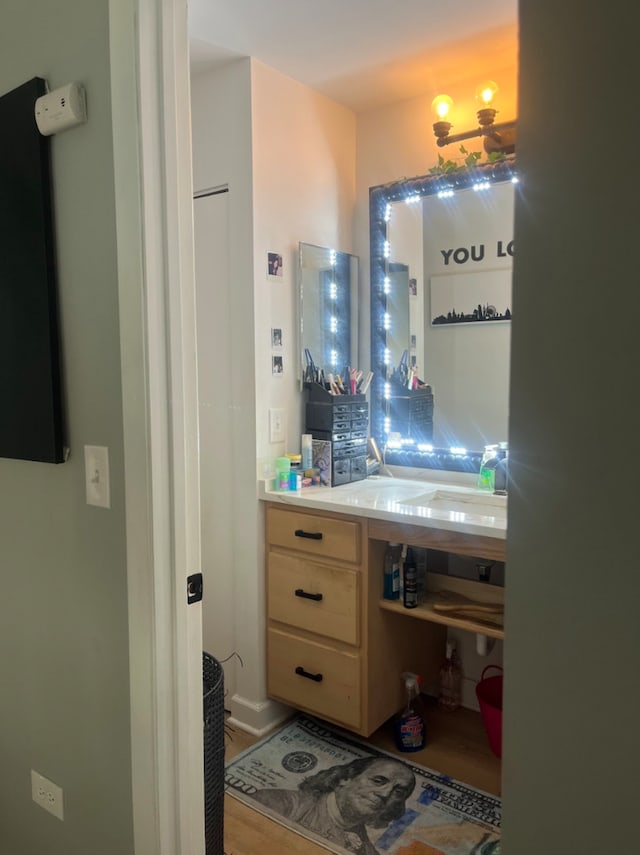 bathroom featuring vanity and wood-type flooring