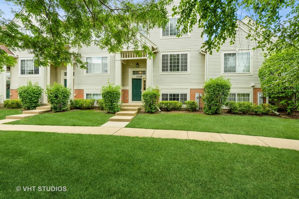 view of front of home with a front yard