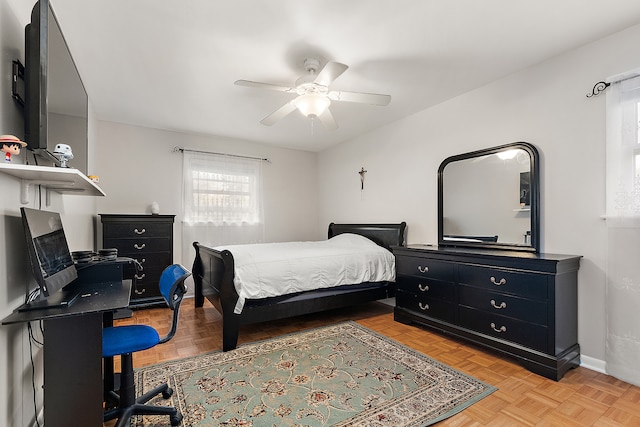 bedroom featuring ceiling fan and light parquet floors