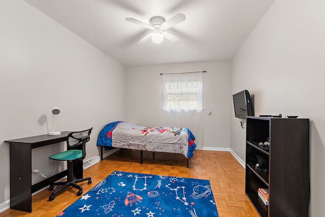 bedroom featuring ceiling fan and parquet floors