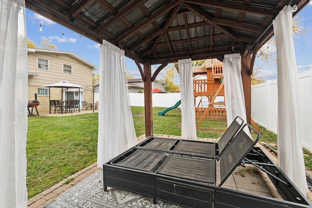 exterior space with a gazebo, a playground, and a patio area