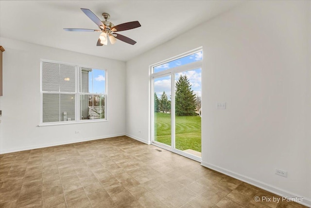 spare room with ceiling fan