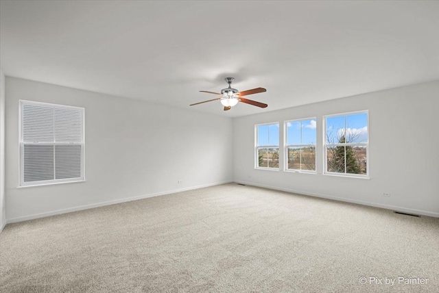 carpeted empty room with ceiling fan