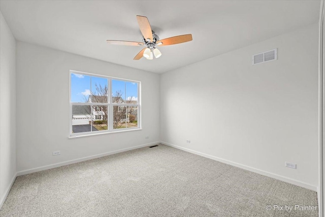 unfurnished room featuring ceiling fan and carpet floors