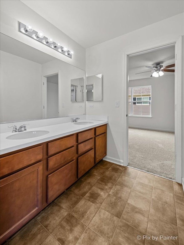 bathroom featuring tile patterned flooring, vanity, and ceiling fan