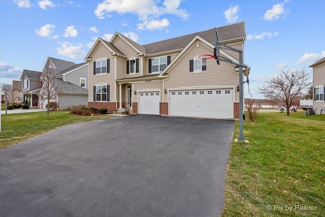 view of front facade featuring a garage and a front lawn