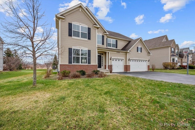 view of front of house featuring a garage and a front yard