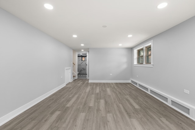 basement featuring light hardwood / wood-style flooring