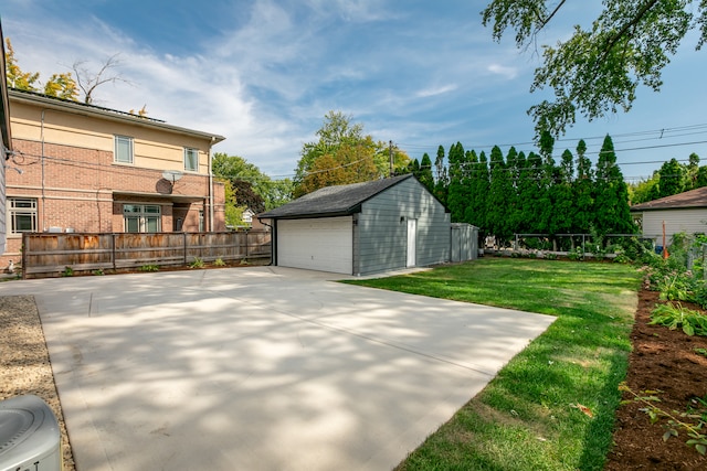 exterior space featuring a garage and an outdoor structure