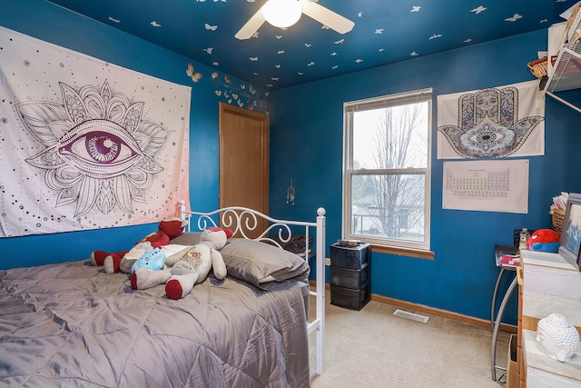 bedroom featuring ceiling fan and light colored carpet