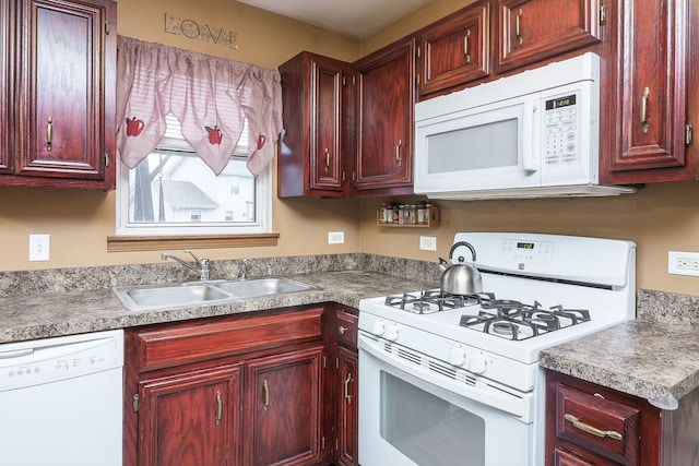 kitchen featuring white appliances and sink