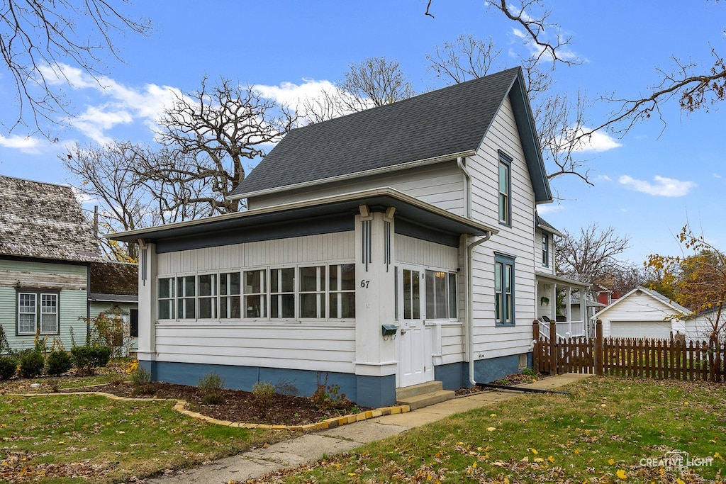 view of property exterior featuring a lawn