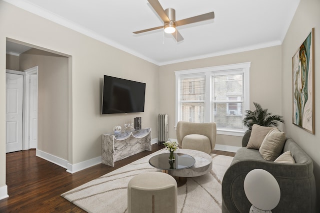 living room featuring ceiling fan, dark wood-type flooring, and ornamental molding