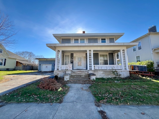 view of front of home featuring covered porch and a garage