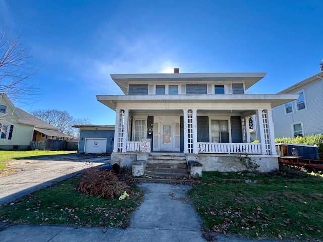 view of front of house featuring covered porch and a garage