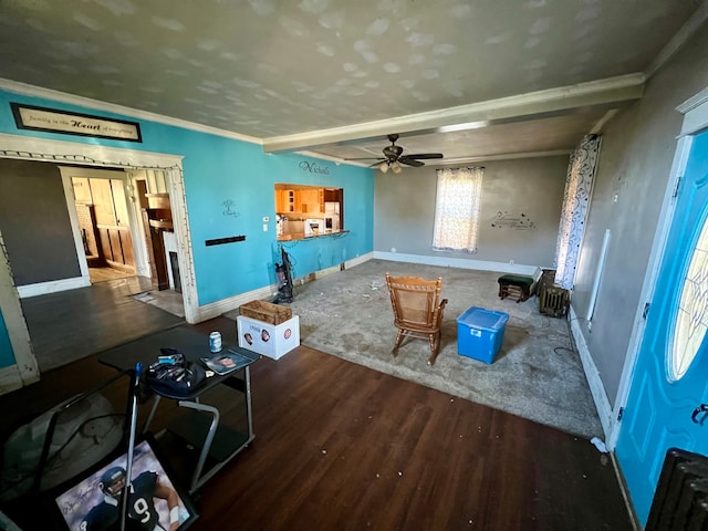 living room with ceiling fan, beam ceiling, dark hardwood / wood-style flooring, and ornamental molding