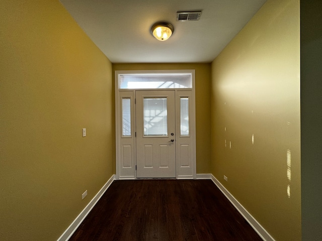 doorway with dark wood-type flooring