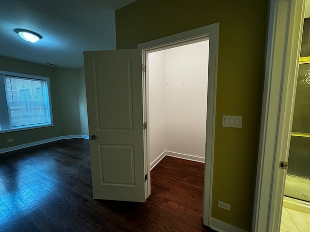 hall with dark hardwood / wood-style floors