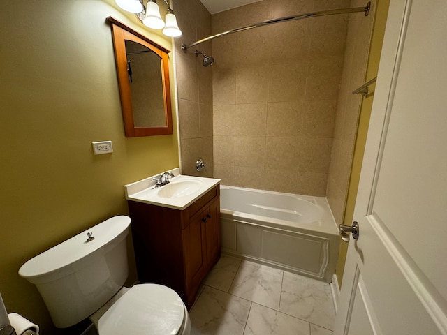 full bathroom featuring vanity, tiled shower / bath combo, and toilet