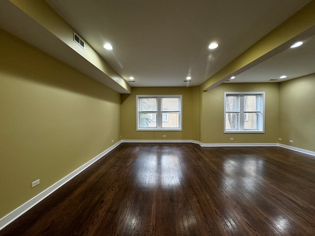 empty room featuring dark wood-type flooring