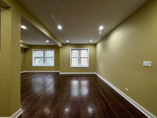 spare room featuring dark hardwood / wood-style flooring