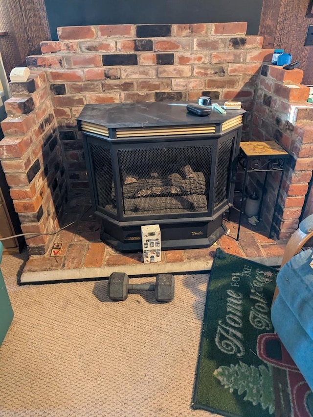 room details featuring carpet and a wood stove