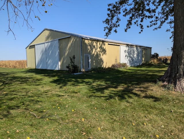 view of outdoor structure with a lawn