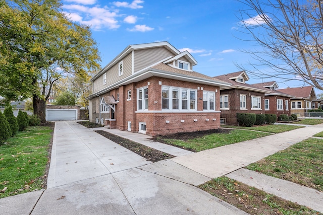 view of front of property featuring a garage, an outdoor structure, and a front yard