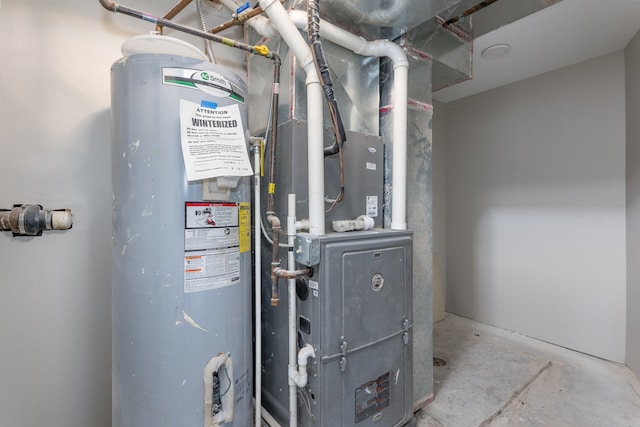 utility room with heating unit and water heater