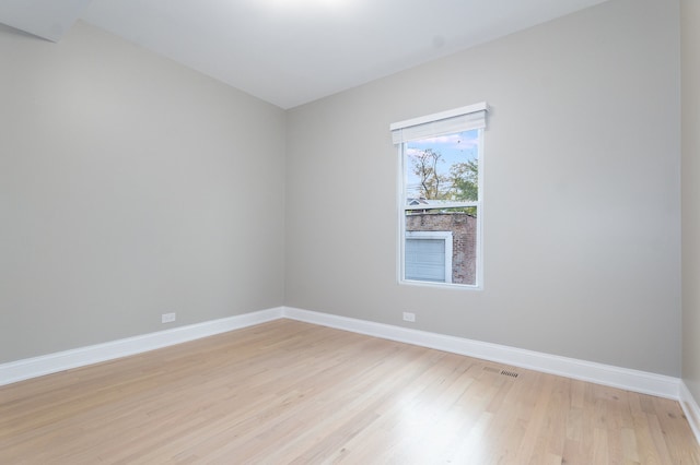 spare room featuring light hardwood / wood-style floors