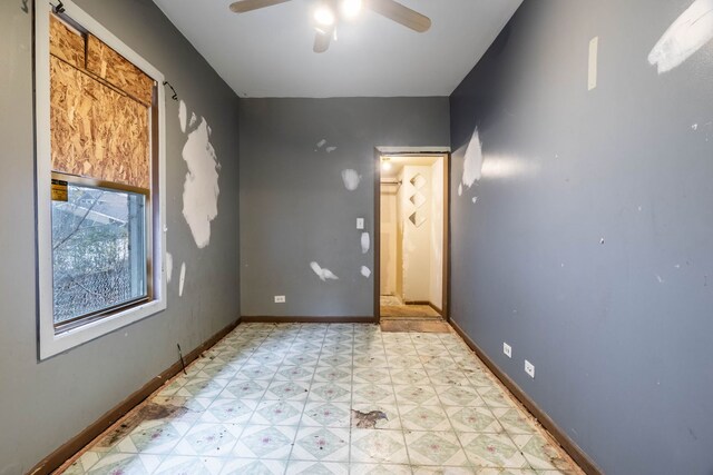 8138 S Harper Ave, Chicago, IL 60619 - unfurnished room with light floors, a ceiling fan, and baseboards