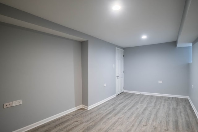 basement featuring light wood-type flooring