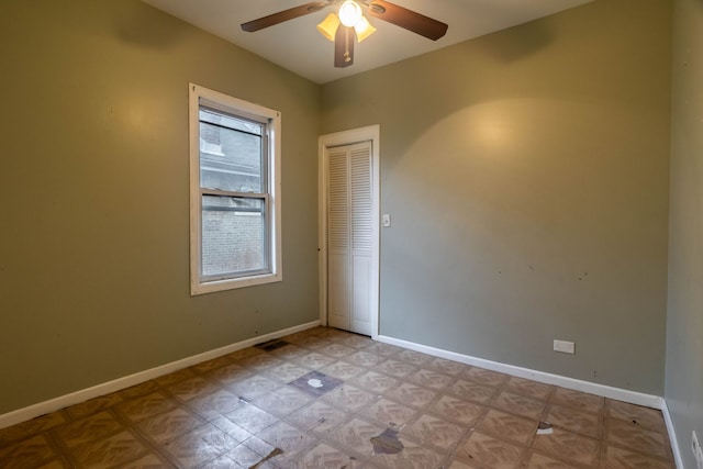 spare room with ceiling fan