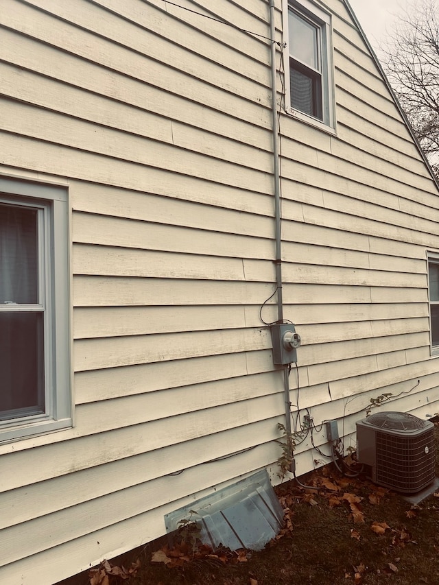 view of side of property with central AC unit