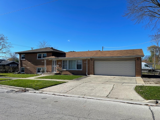 view of front of house with a front yard and a garage