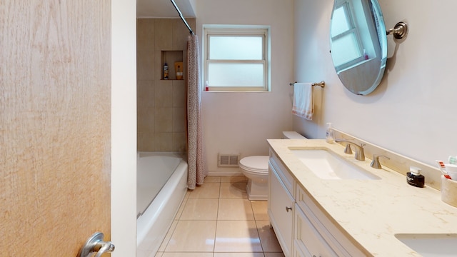 full bathroom with vanity, tile patterned floors, and a healthy amount of sunlight