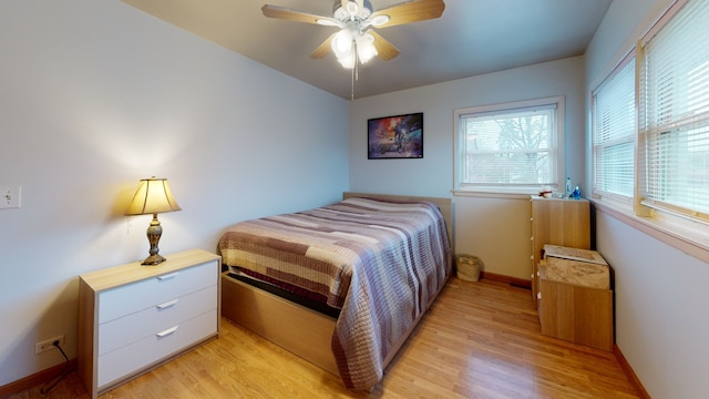 bedroom featuring light hardwood / wood-style floors and ceiling fan